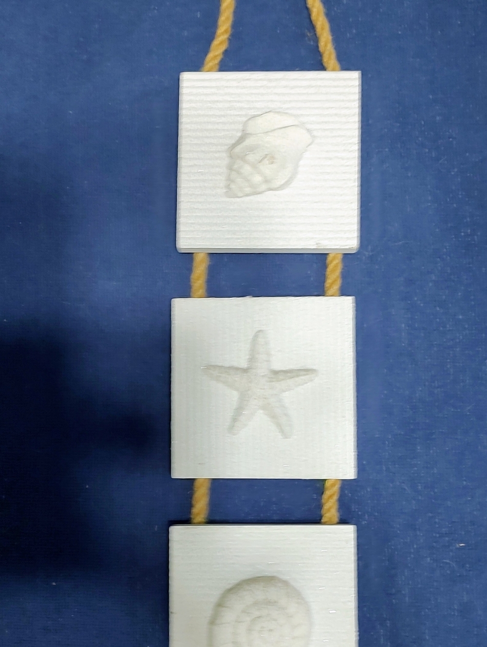White Coastal Wall Hanging with Starfish and Shell Accents